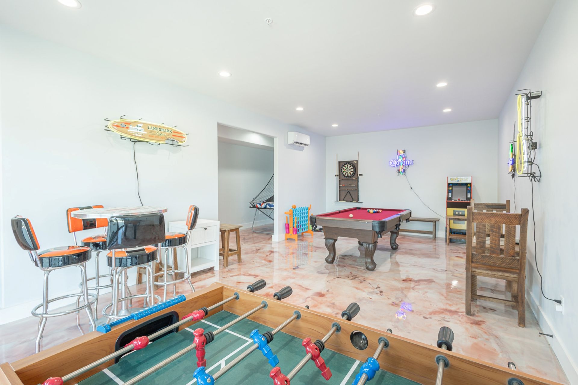 Game room with pool table and foosball