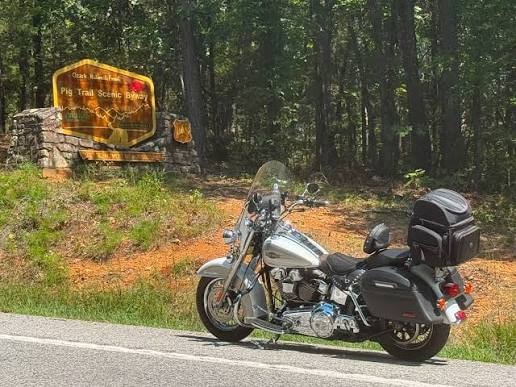Harley-Davidson at Pig Trail Scenic Byway entrance sign