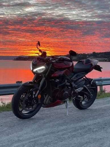 Sport bike at sunset over the lake